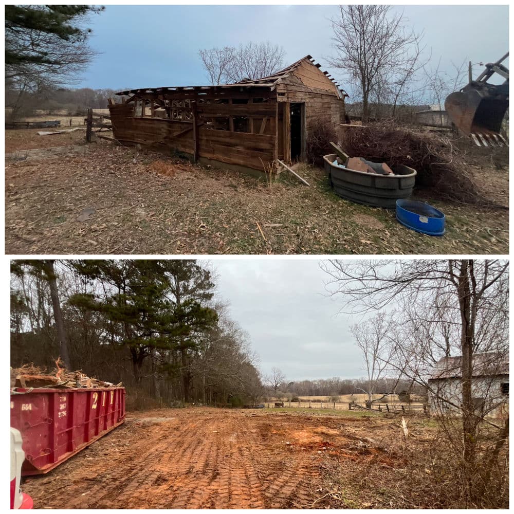 Neglected wooden shed on a rural property with debris and a dumpster in a clearing.